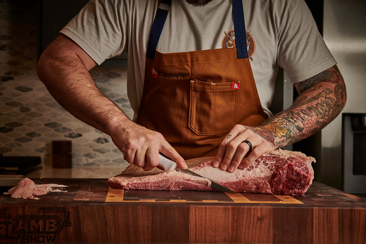 Chef preparing brisket for the smoker