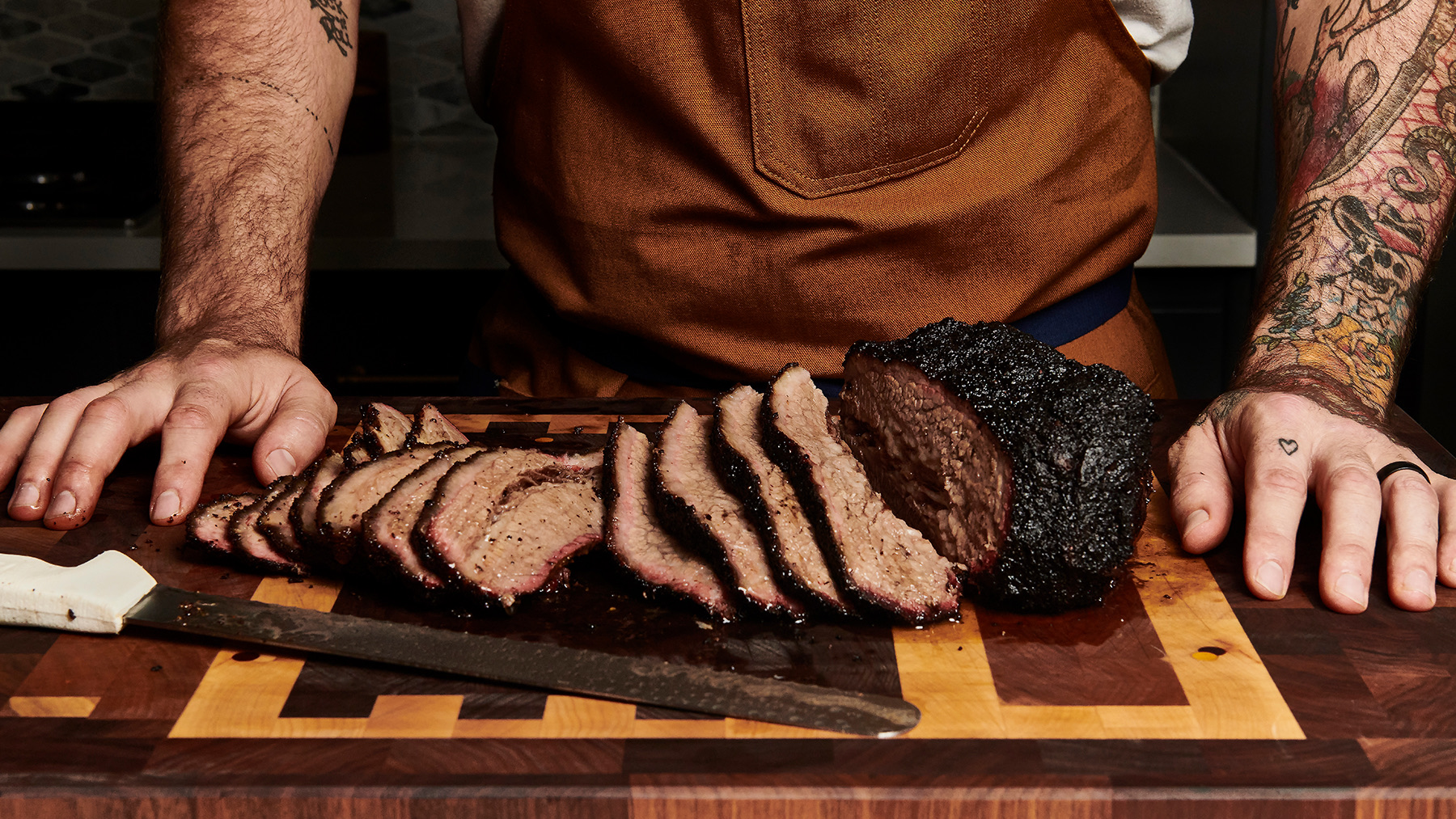 Chef carving barbecue brisket