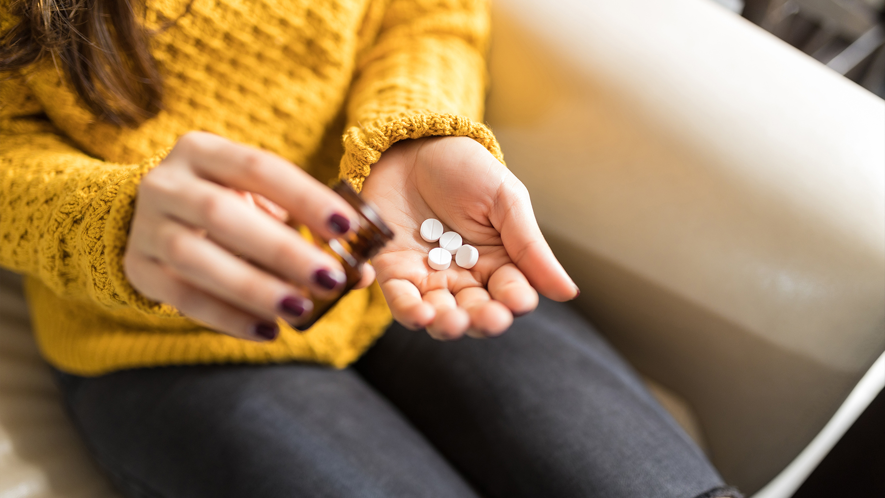 Woman dispensing pills